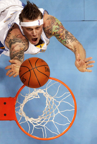 24 hours in pictures: Denver Nuggets centre Andersen scores during an NBA basketball game, Denver