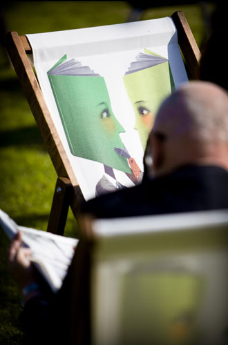 Hay Festival 2009: A man reads in the sun at The Guardian Hay Festival 2009 