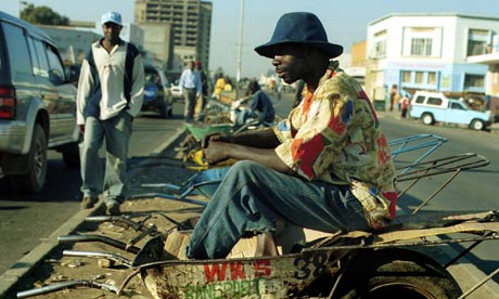 Wheelbarrow pusher in Zambia