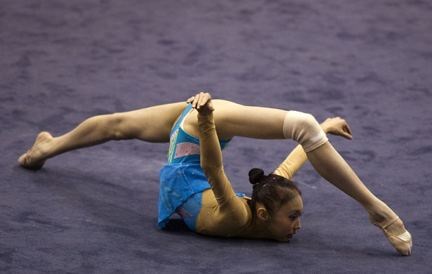 24sport: A girl from China performsduring a team gymnastics performance in Taipei