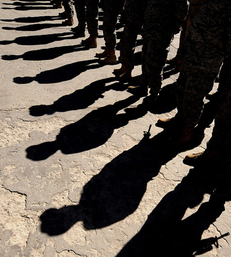 26 May 2009: US soldiers pay their respects during a ceremony at Bagram air base