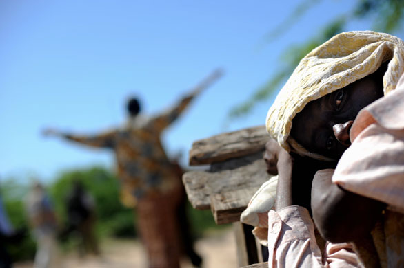 26 May 2009: Somalia: A sick man lies on a wooden cart