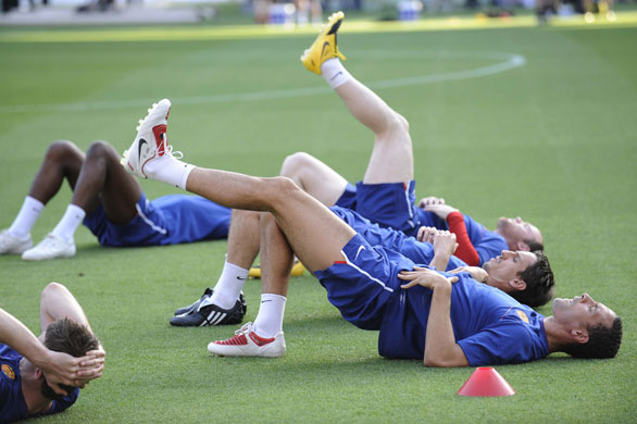 Training Sessions: Rio Ferdinand and Gary Neville stretch their legs