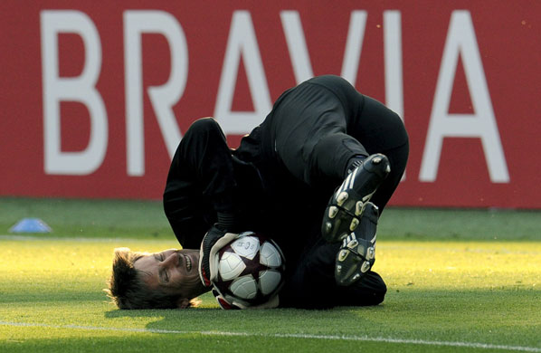 Training Sessions: Edwin van der Sar gets put through his paces