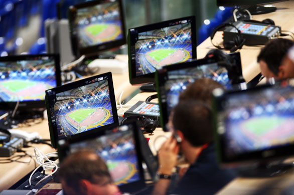 Training sessions:  Journalists watch the Barcelona training session on screens