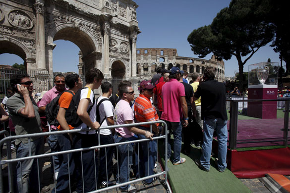 Training sessions: Fans line up to get a close up view of the Champions League Trophy