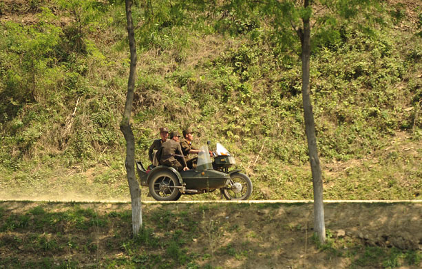 North Korea : North Korean soldiers ride a motorcycle and side-car
