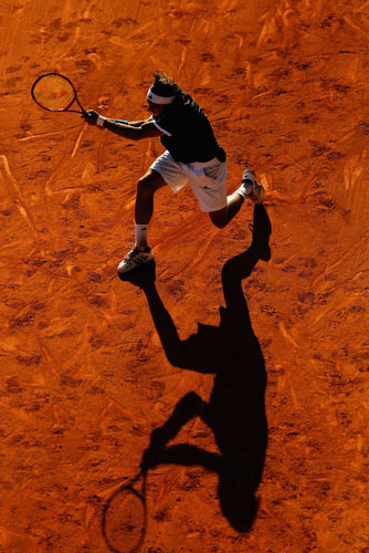 24sport: Juan Monaco hits a backhand 