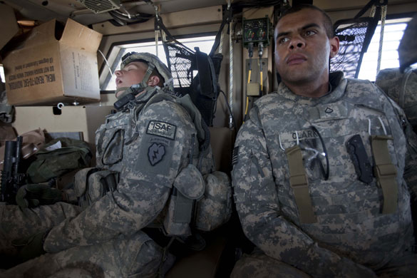 Sean Smith Afghanistan: A soldier sleeps in an MRAP vehicle near Shahin Kalay 