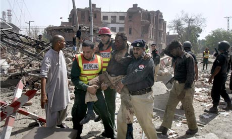 Rescue workers and police help the injured in Lahore