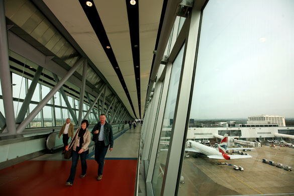 Week in business: Passengers use a state-of-the-art bridge at Gatwick Airport. 