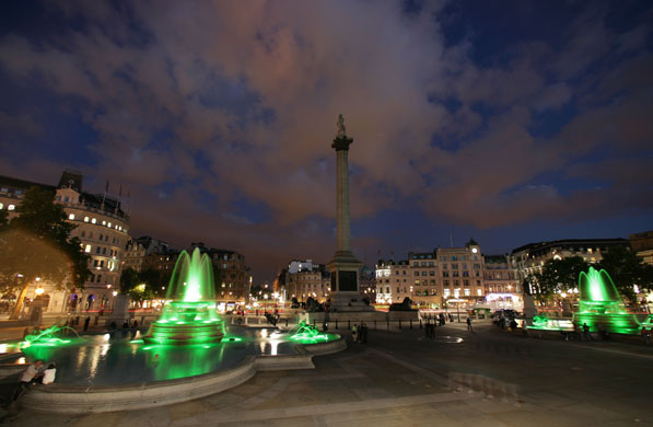 Trafalgar Square fountain: The fountains glow green
