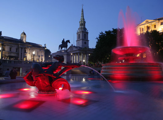 Trafalgar Square fountain: The lights glow bright red