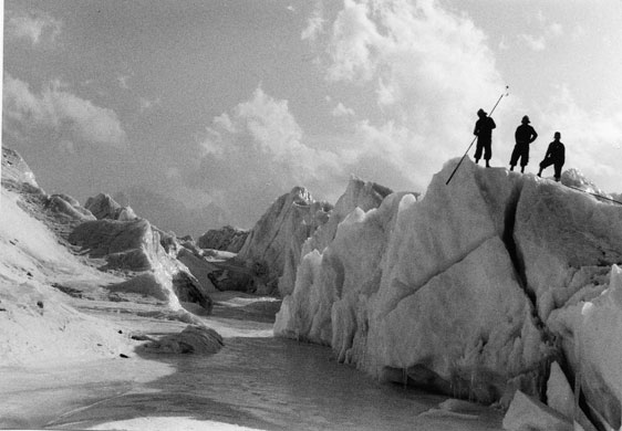 Changing Landscapes: Khumbu, Nepal, 1956: A research team stand on a serac to inspect the ice