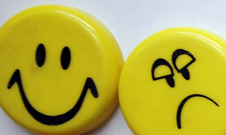 Smiley face and sad face How do you measure happiness and wellbeing