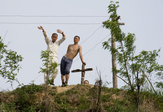 North Korea Border: North Koreans wave at tourists on the riverside of the Yalu river