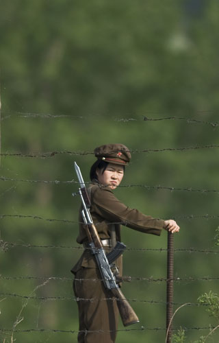 North Korea Border: A North Korean soldier at the international border of China and North Korea