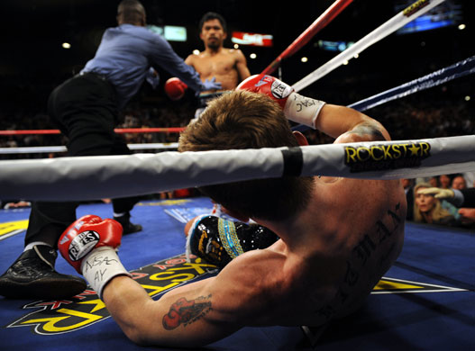 Hatton and Pacquiao: Manny Pacquiao looks at Ricky Hatton during their title fight