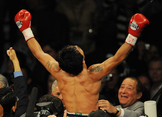 Hatton and Pacquiao: Manny Pacquiao celebrates after knocking out Ricky Hatton