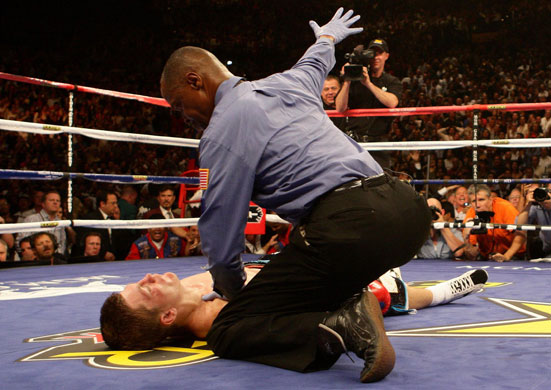 Hatton and Pacquiao: Referee Kenny Bayless calls off the fight after Hatton was knocked out