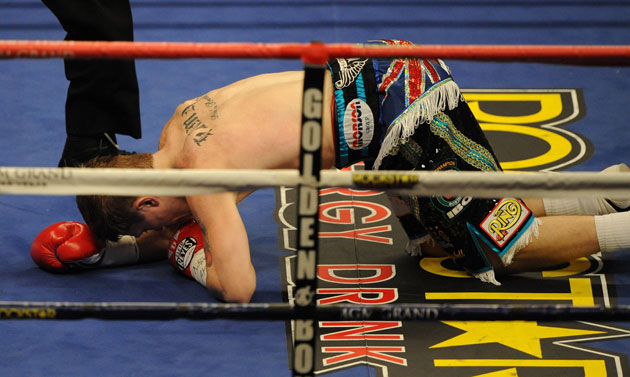 Hatton and Pacquiao: Ricky Hatton on the mat after being knocked out for the first time