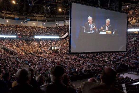 Warren Buffett and Berkshire Hathaway's vice-chairman, Charlie Munger, are projected on a large screen at the AGM