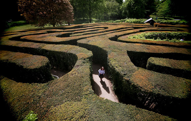 3 May 2009: London, UK: A young girl navigates her way around Hampton Court maze