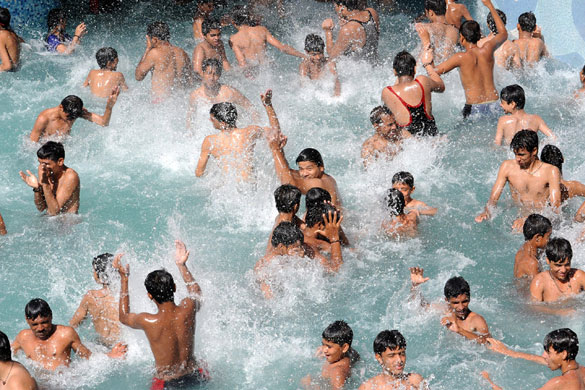 3 May 2009: Ahmedabad, India: Youths cool off in a pool at Jaldhara Water World