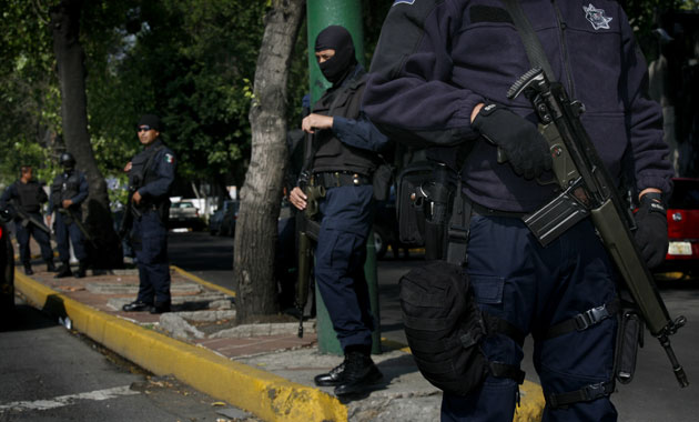 31 May 2009: Mexico City, Mexico: Federal police agents stand guard