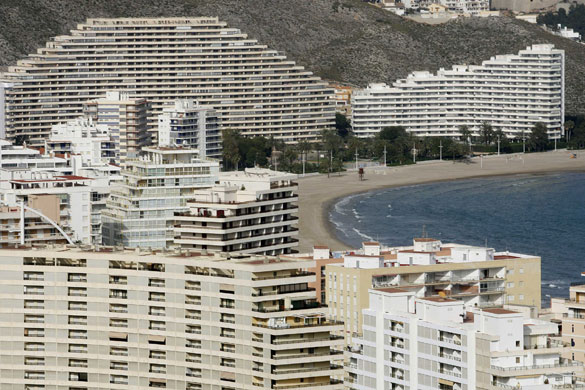Spanish coastlines: 2009: Buildings line up at the beach of Cullera near Valencia