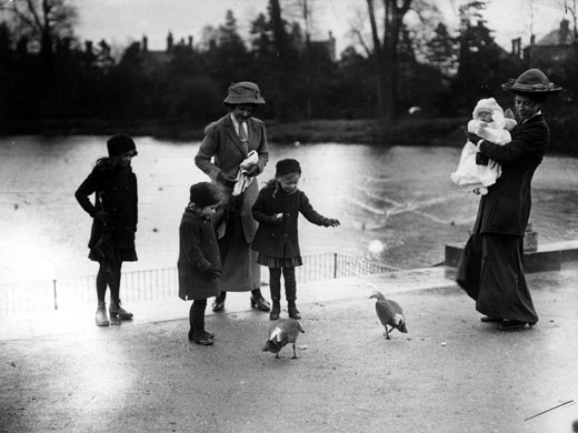 Kew Gardens: 1913: Children with their nannies feeding the ducks