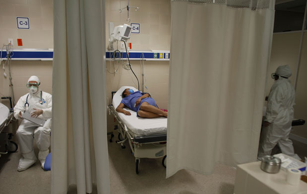 4 May 2009: Mexico City: A woman in bed while under observation at the Naval hospital