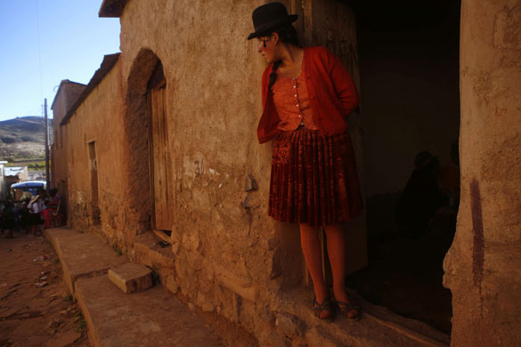 Thinku festival: A woman watches from a doorway