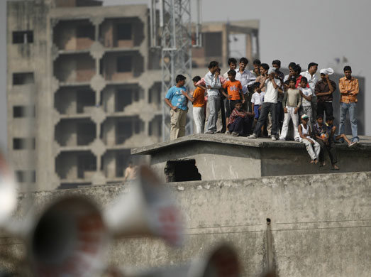 Gandhi election campaign: 30 April, Ghaziabad: People watch as Rahul Gandhi addresses a rally