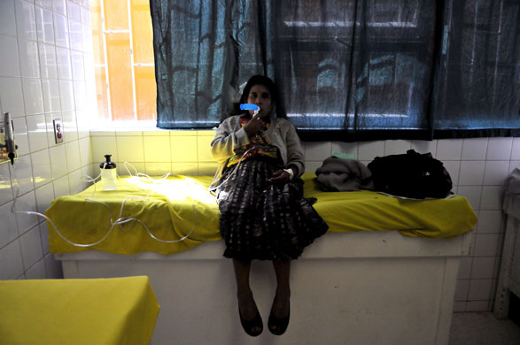 6 May 2009: Guatemala City: Nasaria Ramirez Boror inhales oxygen in a hospital