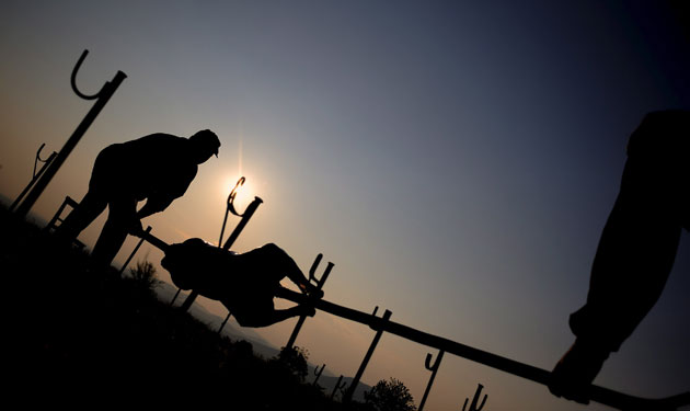6 May 2009: Patalenicha, Bulgaria: People prepare whole lambs