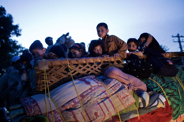 24 hours in pictures: Refugees Flee Fighting in North West Frontier Province