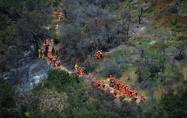 California Wildfires: Hand crews walk up Rattle Snake canyon trail to put out a hot spot