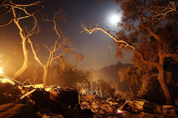 California Wildfires: A destroyed home continues to smolder