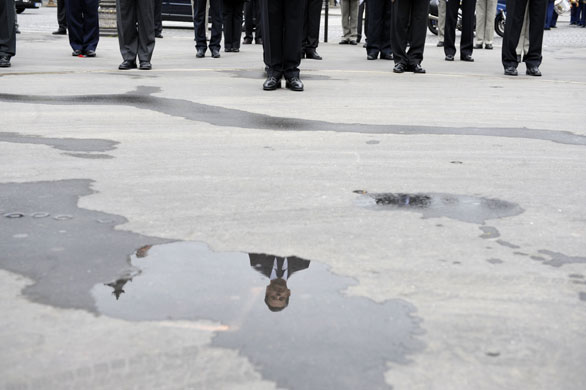 24 hours in pictures: Nicolas Sarkozy lays a wreath at the statue of General Charles de Gaulle 