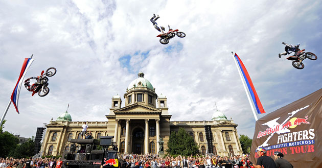 24sport: Motorcyclists perform during the 'Red Bull X Fighters' motocross show