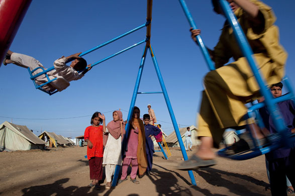 IDP camps Pakistan: Children play in makeshift playground at the Chota Lahore relief camp