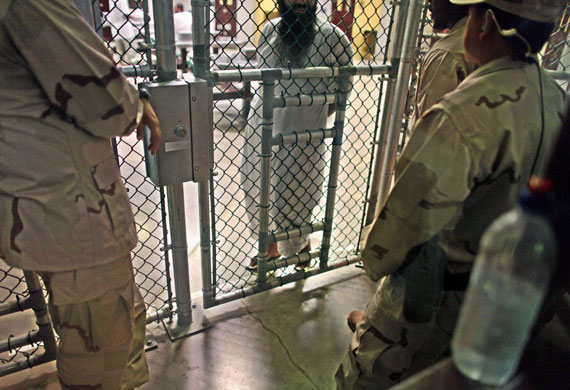 1 June 2009: Guantanamo, Cuba: A detainee speaks with guards 