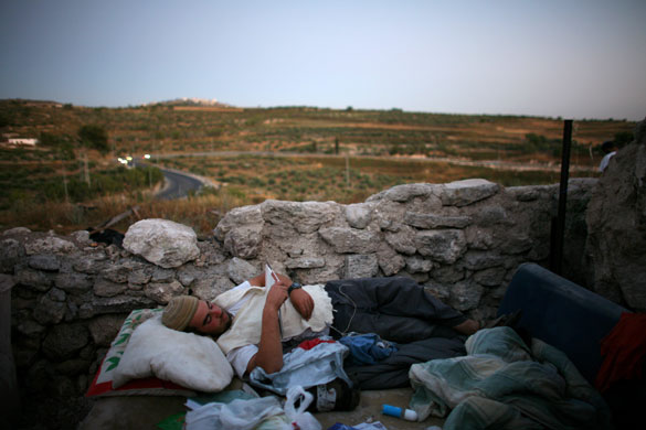 1 June 2009: Shvut Ami, West Bank: A Jewish settler reads