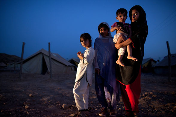 1 June 2009: Jalozai Camp, Pakistan: Girls stand near their tents