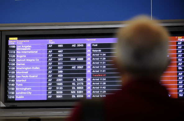 Rio plane crash: A man looks at an arrival information sign