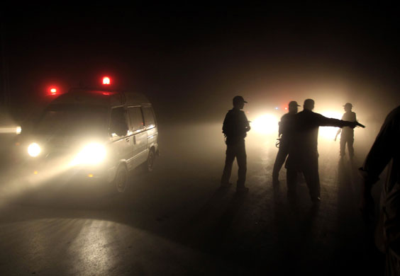 Peshawar bombing: Pakistani Police officers secure the area after an explosion in Peshawar