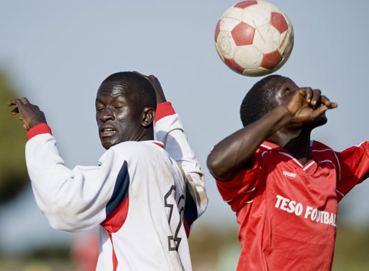 Katine: Katine Actors Paul Emunyu (L) is tackled by Eagles FC Thomas Oyugi