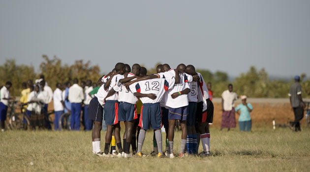 Katine: The Katine Actors huddle before the match against the Eagles FC