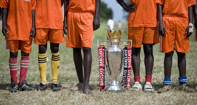 Katine: The Aloet Super Defenders team pose with the Barclays Premier League trophy